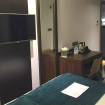 A typical double room with flatscreen TV at Maitrise Hotel London Maida Vale